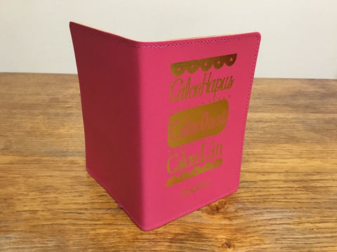 'Calon Hapus, Calon Onest, Calon Lân' Pink Passport Cover by Lizzie Spikes