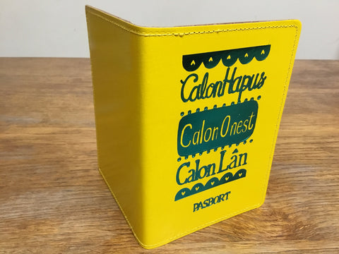 'Calon Hapus, Calon Onest, Calon Lân' Yellow Passport Cover by Lizzie Spikes
