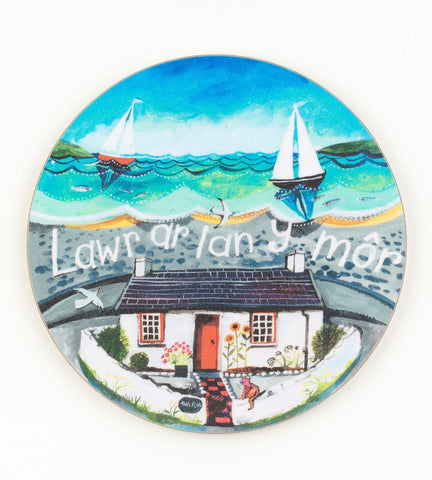 'Lawr ar lan y môr' round coaster by Lizzie Spikes