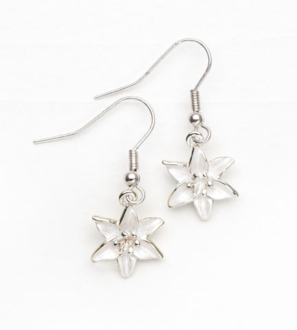 Enamel white lily drop earrings on silver-plated hooks
